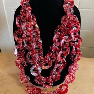 Sassy Jones Zaria necklace in a red and clear speck pattern